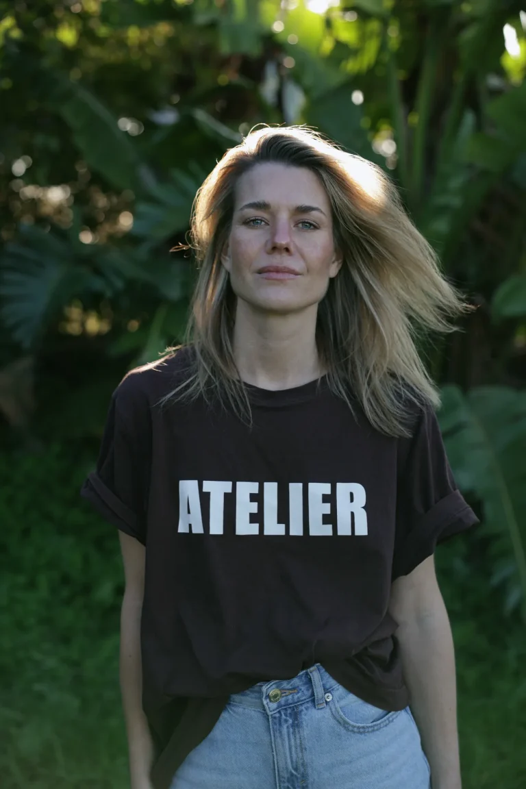Woman in black Atelier shirt outdoors