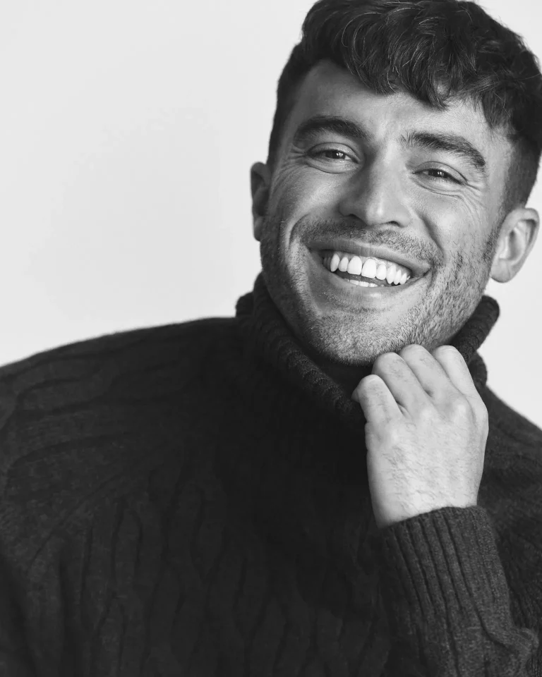 Smiling man in dark turtleneck portrait